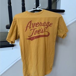 Tultex mustard colored “Average Toe” t shirt